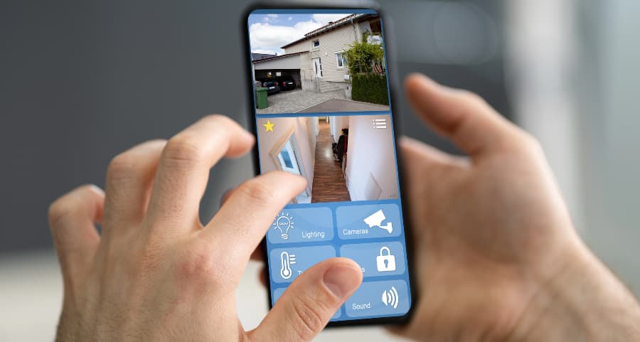 Resident looking at surveillance camera footage on a cell phone